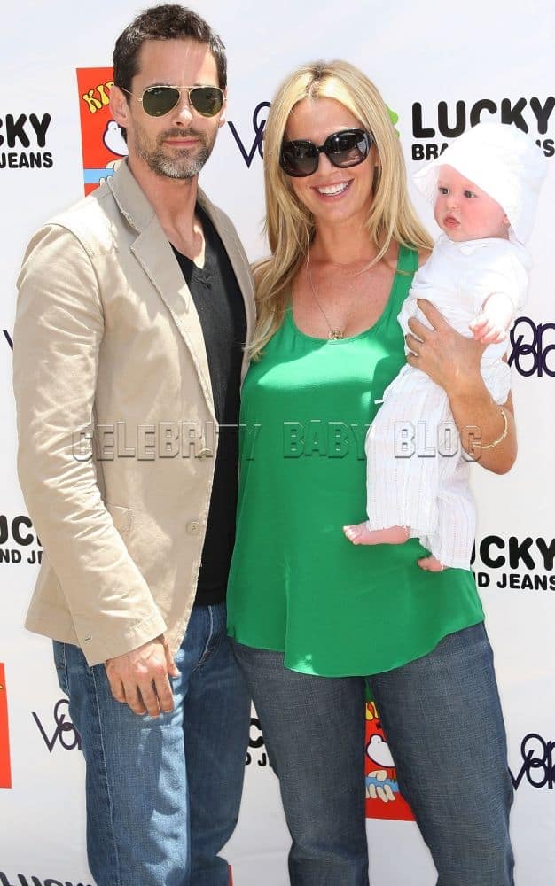 Adam Kaufman and Poppy Montgomery with their baby.