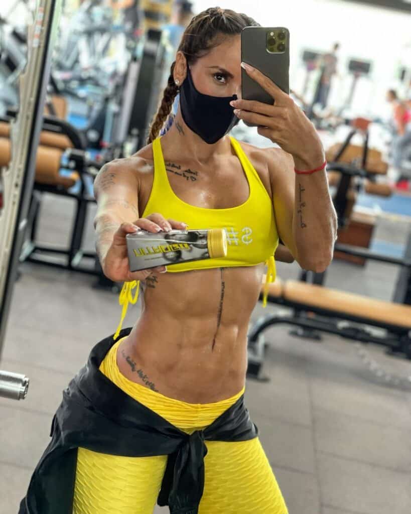 Sonia Isaza showing her NitroFit supplement after workout