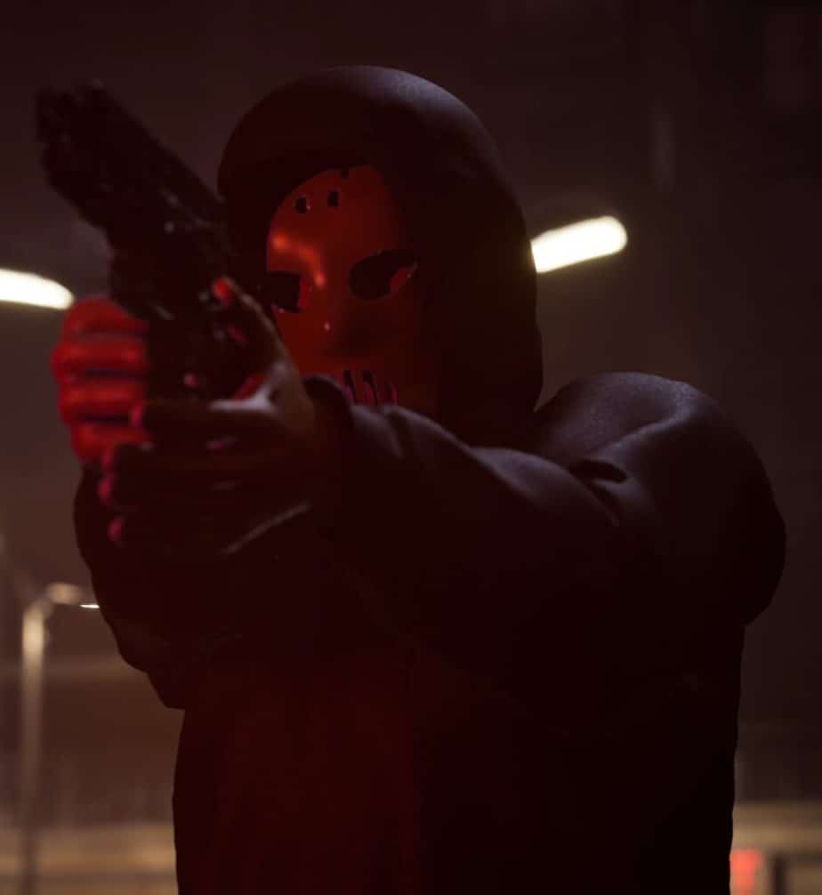 Angerfist pointin gun at someone during his music video shooting