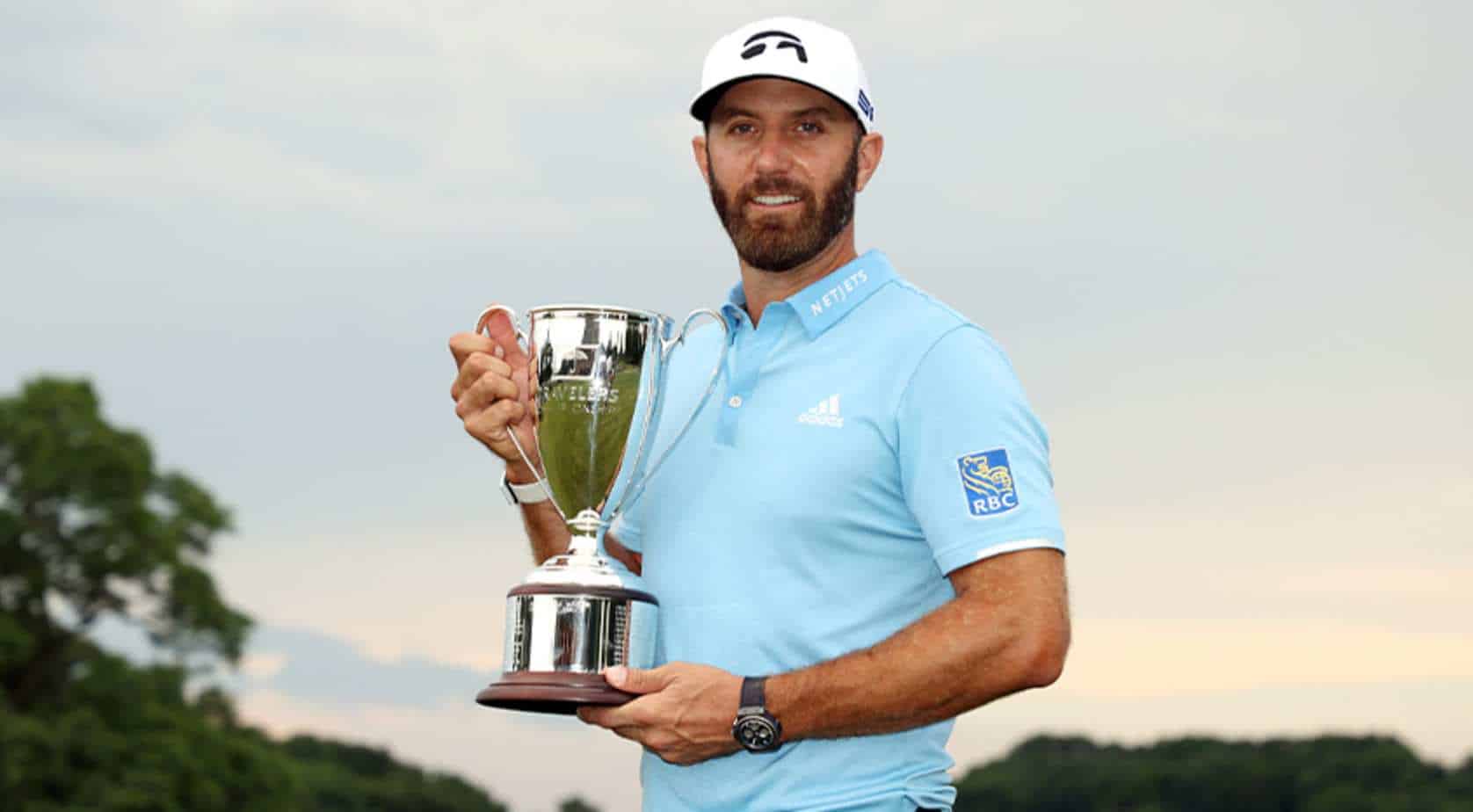 Dustin Johnson lifting U.S Opens Trophy