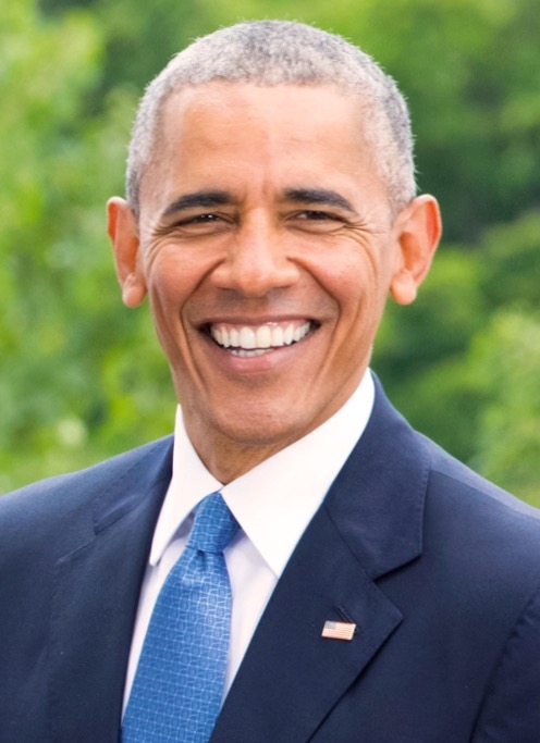 Barack Obama smiles for the cameras