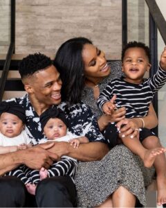 Russell with his wife & kids