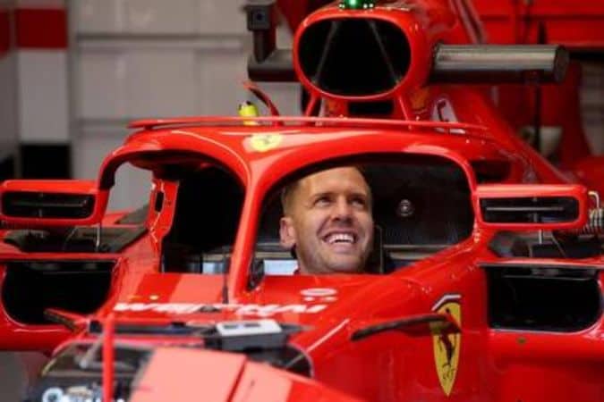 Sebastian Vettel Behind the Ferrari Wheels