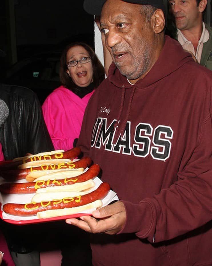 Bill Cosby with a hotdog for his Tasty Tuesday program