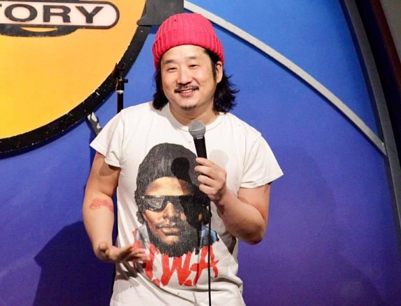 Bobby lee performing in a show.