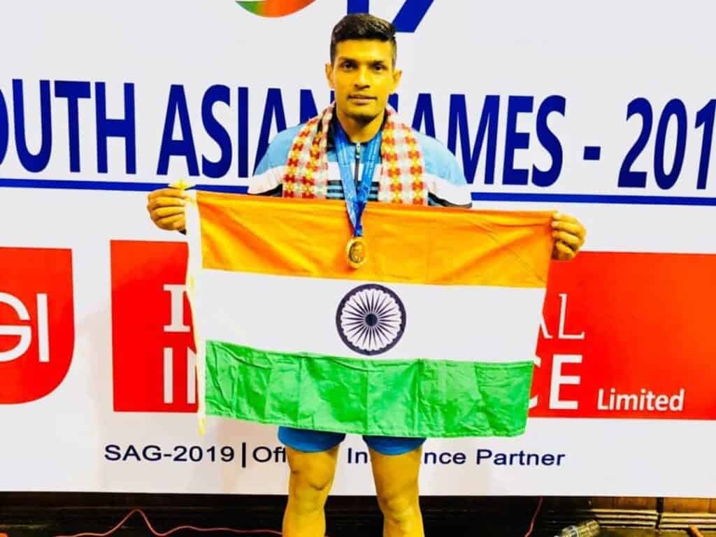 Hooda with Indian flag after winning 2019 South Asian Games in Kathmandu