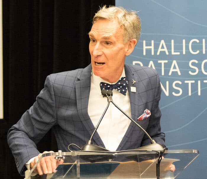 Bill Nye is talking in an event.
