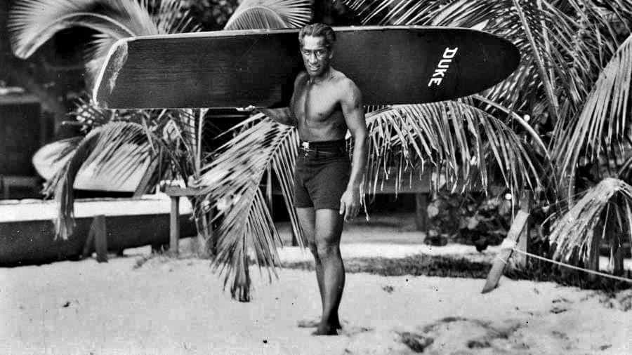 Duke Kahanamoku and his surfboard
