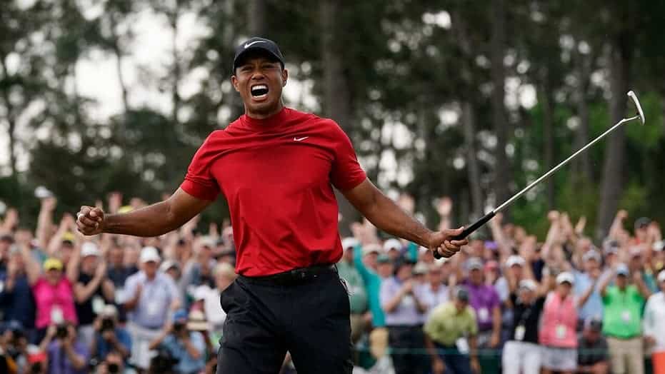Tiger Woods posing after a win