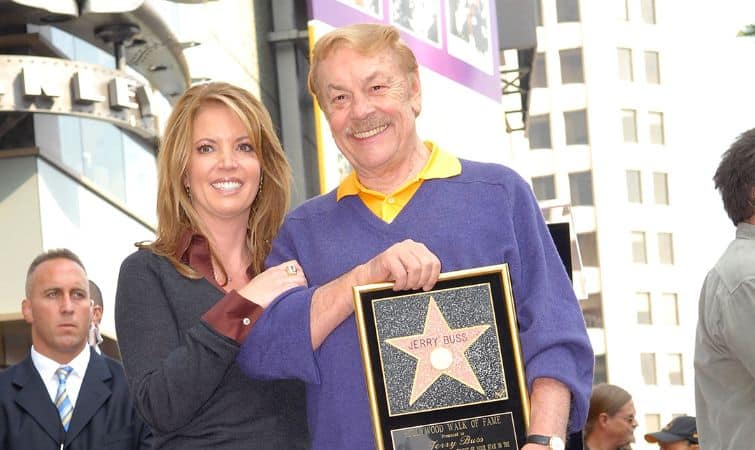 Buss with his daughter holding star award
