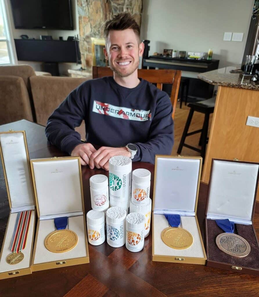 joey-mantia-showcasing-his-medals-and-achievements