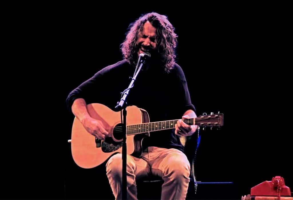 Chris Cornell sings during a concert.