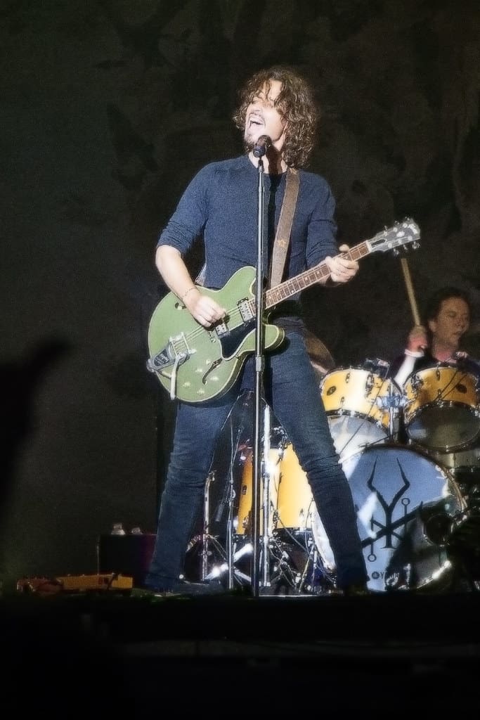 Chris Cornell playing the guitar.