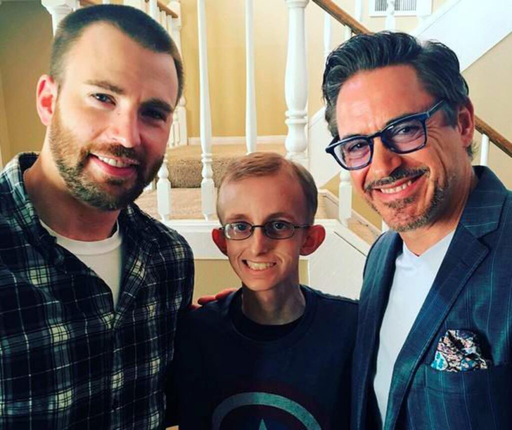 Chris Evans and Robert Downey Jr. with a fan.