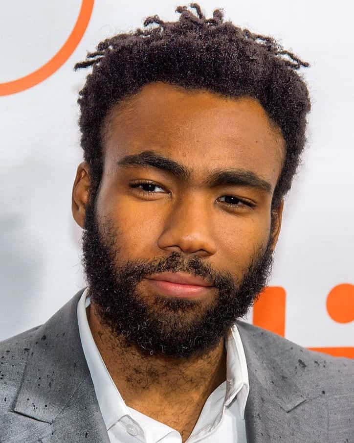 Donald Glover posing for a picture.