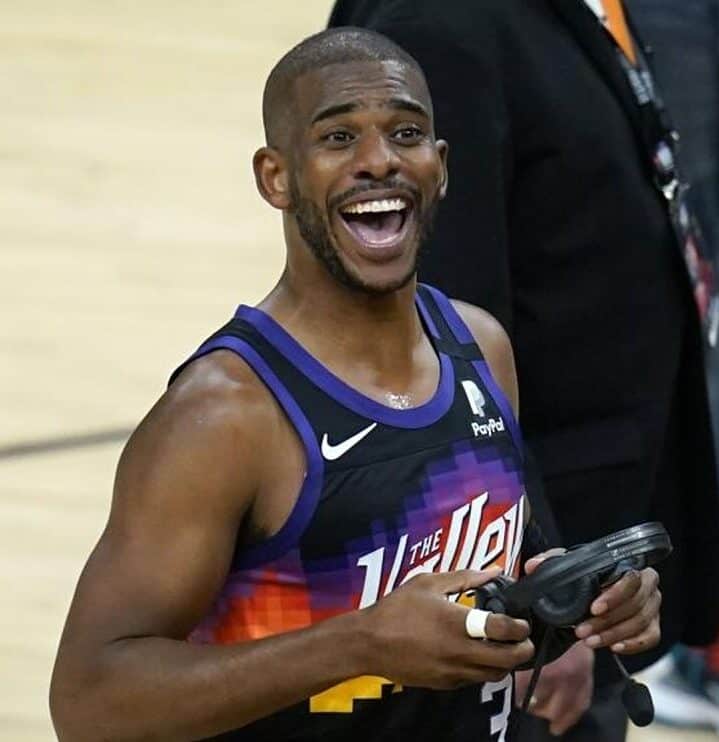 Chris Paul is Smiling at the Audience.