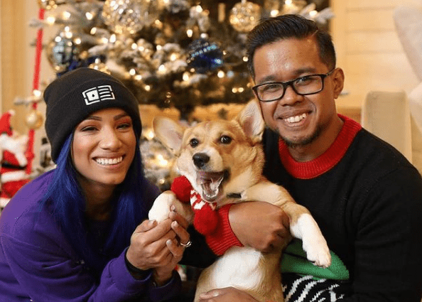 Sarath Ton celebrating Christmas with his wife Sasha Banks and their dog