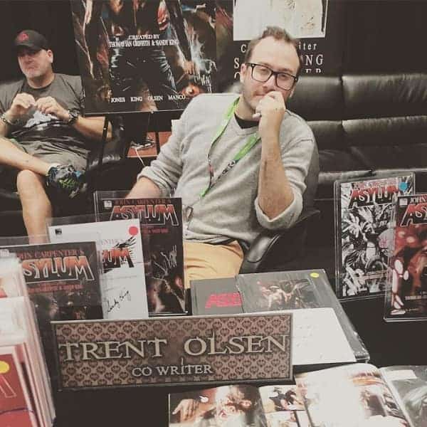 Trent Olsen with his comic books