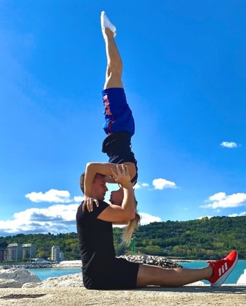 Zayats Aliaksei lifting Kristina Lishova for a acrobatic pose