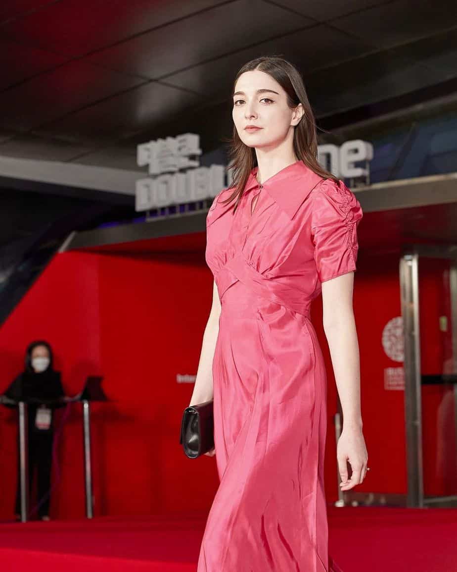 Amalia Ulman posing for a photo in an event.