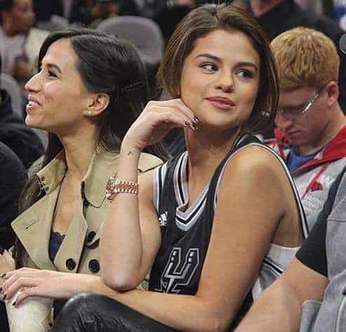 Axelle Francine and Selena Gomez in a NBA game.