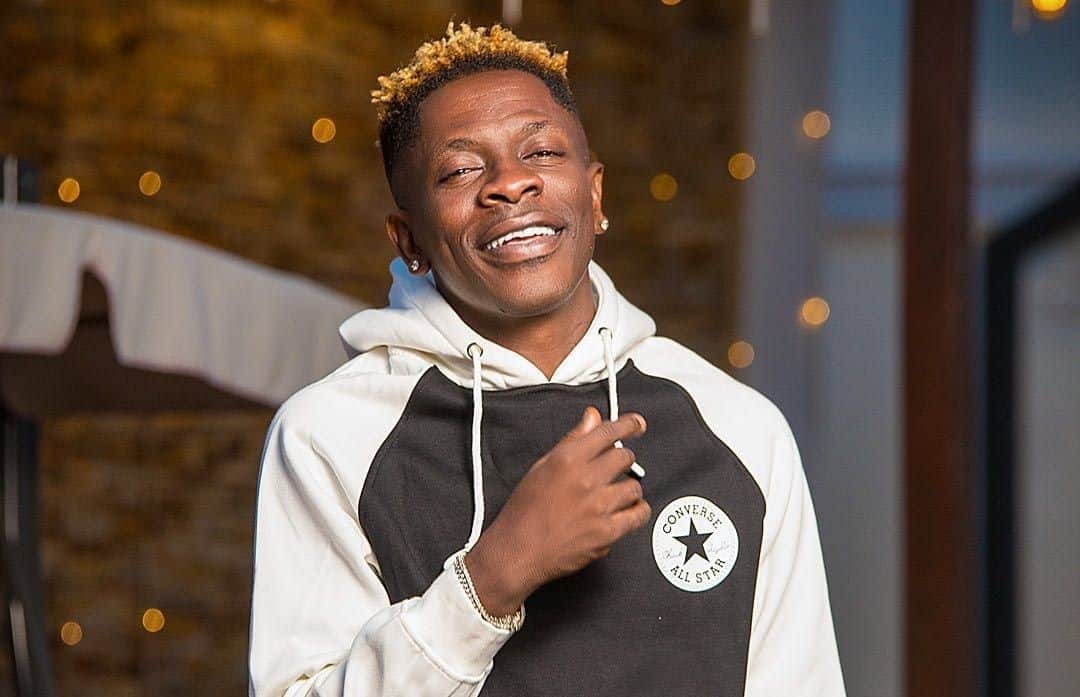 Shatta Wale with a wide smile