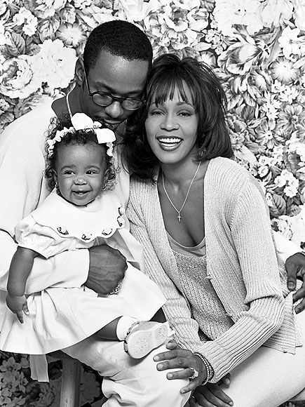 Whitney Houston with her husband and daughter.