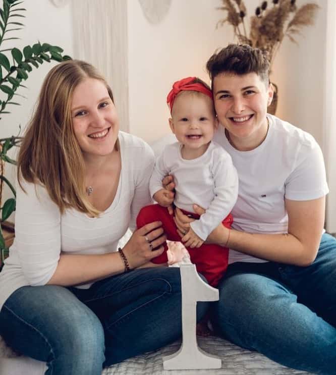 Aneta with her wife and child