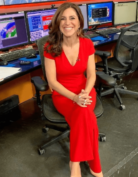Cindy Fitzgibbon in a red dress.