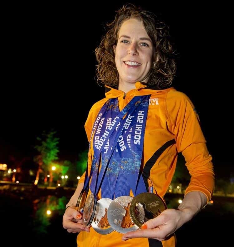 Ireen Wust showing her Olympic Games medals