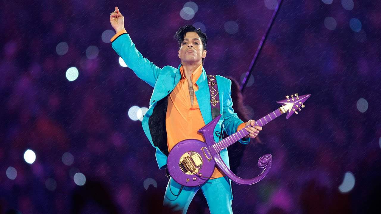 Prince in purple attire.