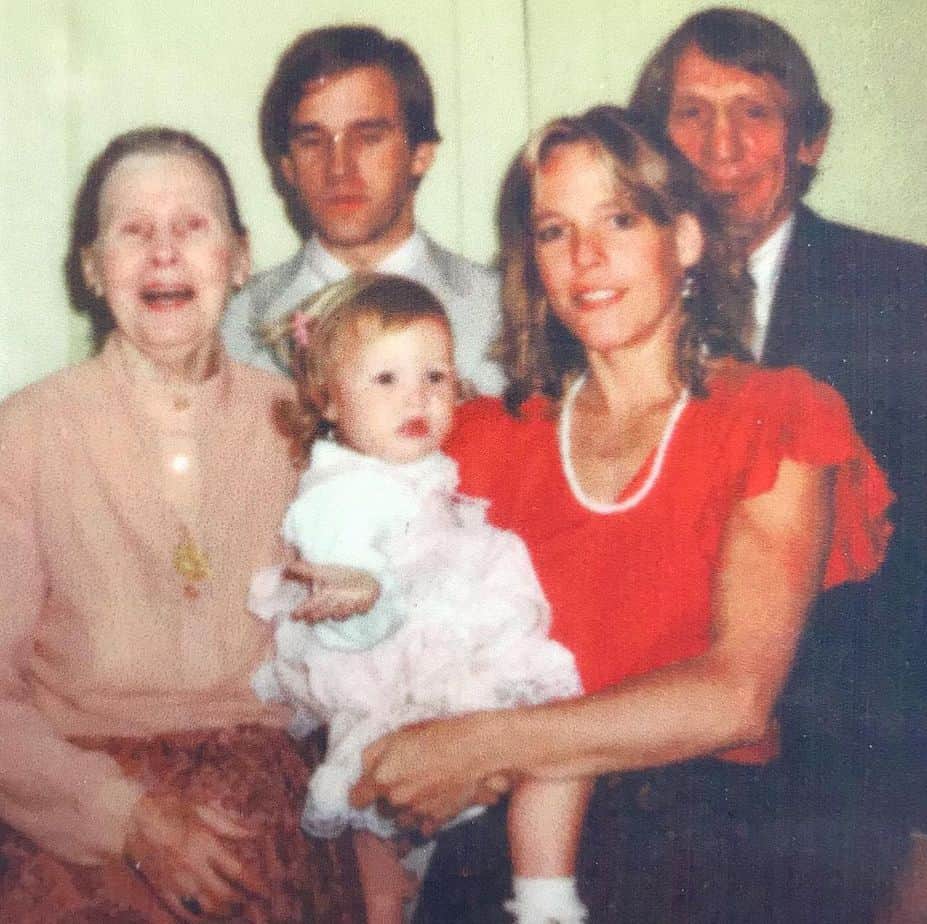 A picture of Julia with her family during her childhood.