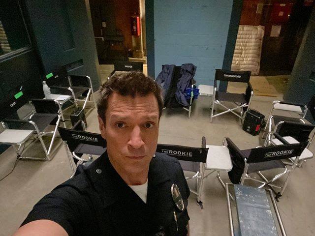 Nathan-Fillion-taking-a-selfie-in-The-Rookie-set