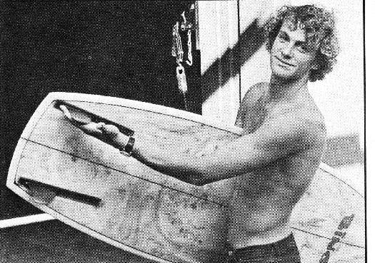 Rolf Aurness with his surfboard.