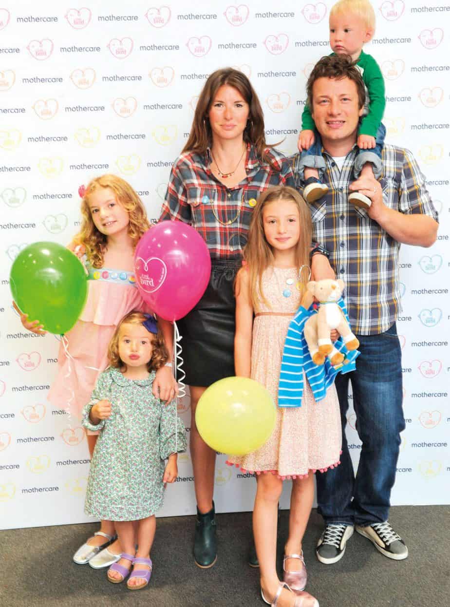 Jamie Oliver with his wife and children (source: Woman and Home)