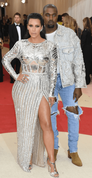 Kim Kardashian & Kanye West in matching silver outfits (Source: Vogue)