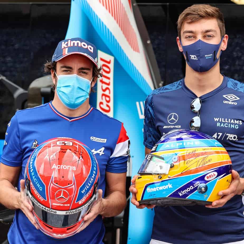 Fernando Alonso (Left) and George Russell (Right) exchanging helmet during Monaco Grand Prix (Source: FormulaRapida)