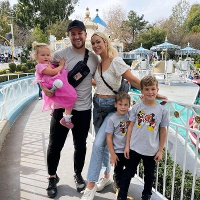 Mat Barkley with his wife and children in theme park