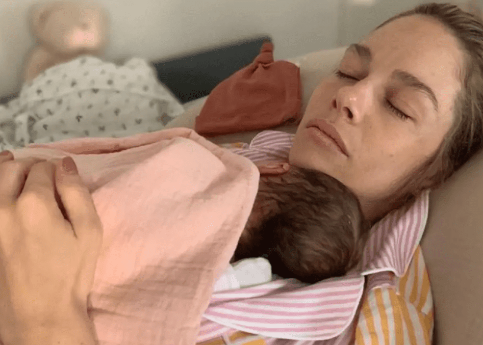 Morin holding her newborn (Source: 247 News)