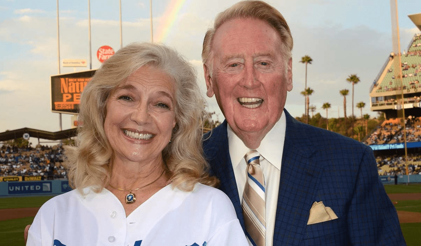 Sandra Hunt & Vin Scully during a game (Source: The Hollywood Reporter)