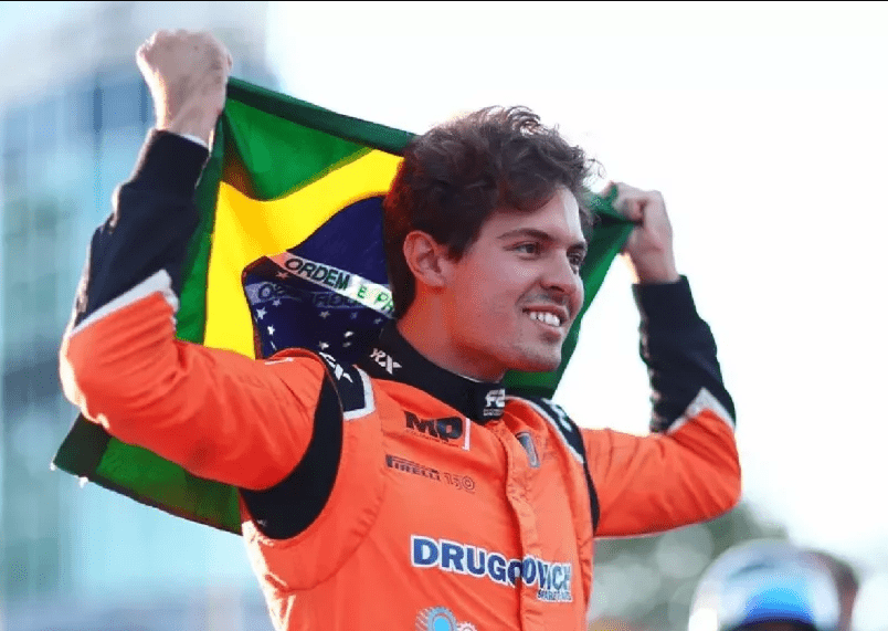 Felipe Drugovich holding Brazil Flag